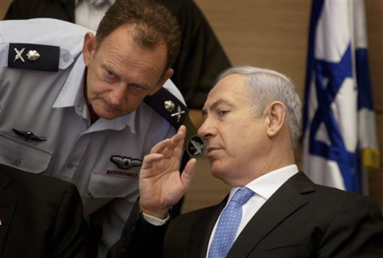 Israeli Prime Minister Benjamin Netanyahu, right, listens to his military advisor Maj. Gen. Yohanan Locker, as he attends a meeting Monday of the Foreign Affairs and Defense Committee, in the Knesset, Israel's parliament in Jerusalem.
